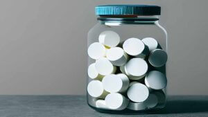 jar of prescription pills sits on a table